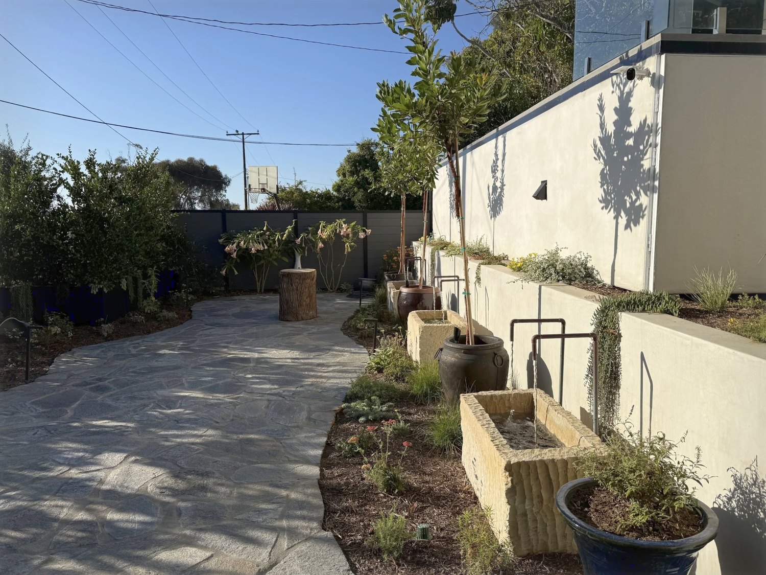 The finished street elevation, with planted terraces held on new retaining walls