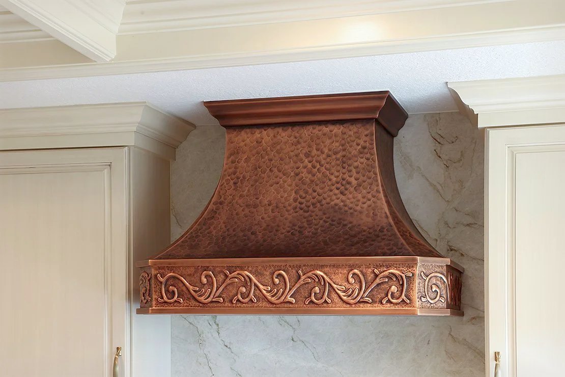 Hammered copper, set between two cabinets