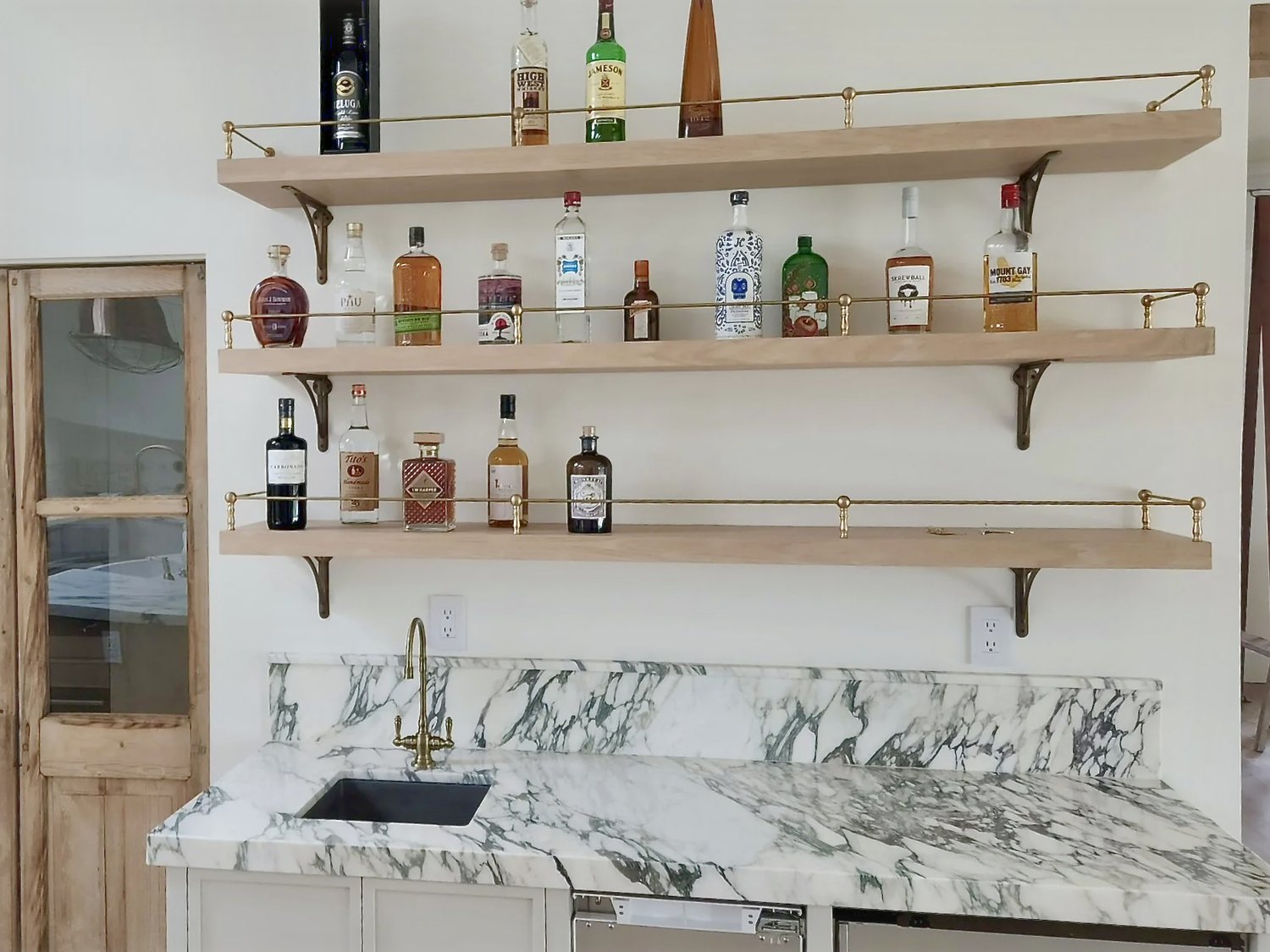 Marble, oak and brass, on one wall