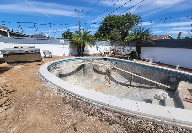 The old pool shell stripped back, ready for the new form.